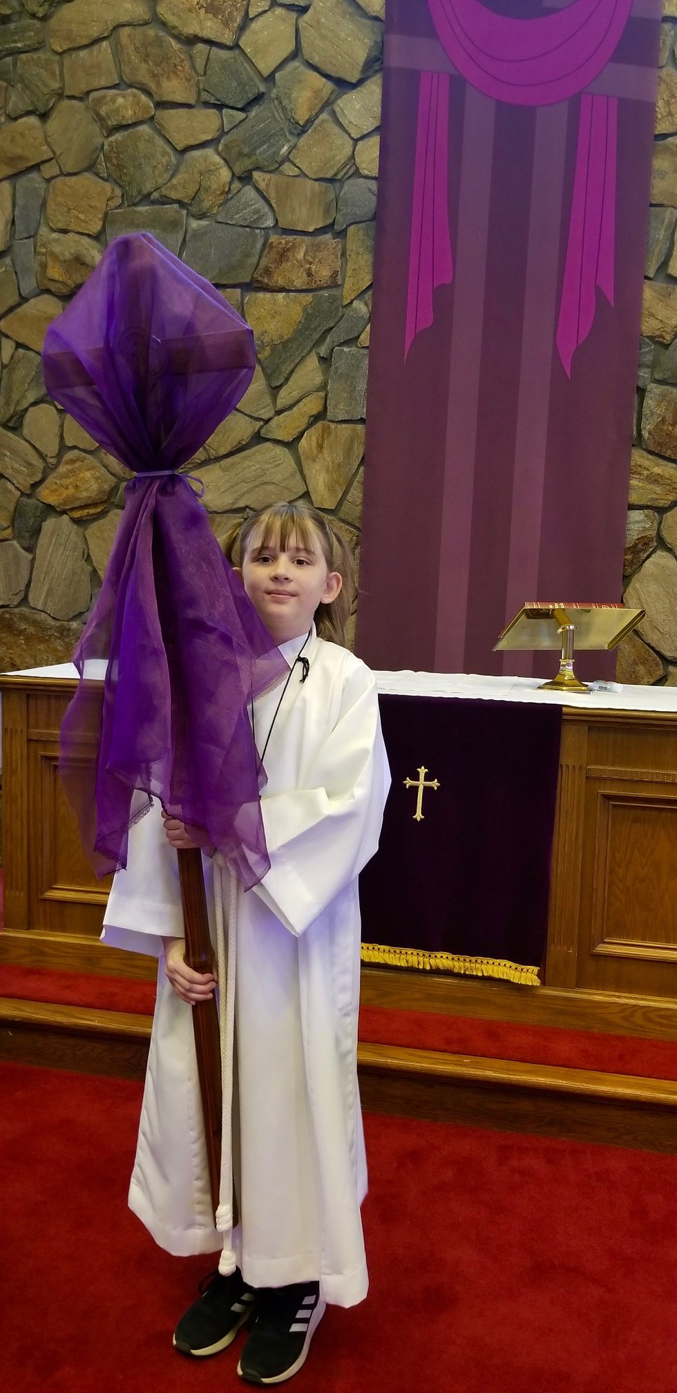 Young acolyte assisting during service